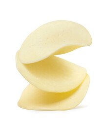 Round pieces of cheese fall on a white background. Isolated