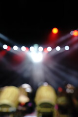 Defocused entertainment concert lighting on stage, blurred disco party and Concert Live.