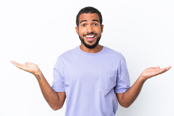 Young Ecuadorian man isolated on white background with shocked facial expression