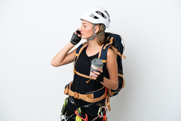 Young caucasian rock climber woman isolated on white background holding coffee to take away and a mobile
