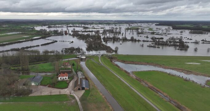 Aerial drone view of high water flooding on the Ijssel river. The Netherlands.