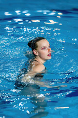 Serene beauty of solo synchronized swimming, a captivating display of aquatic grace and precision.