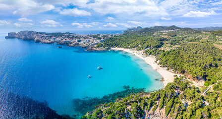 Aerial view of Cala Agulla and beautiful coast at Cala Ratjada, Mallorca: pristine beach, crystal waters, surrounded by nature, perfect Mediterranean escape. - obrazy, fototapety, plakaty