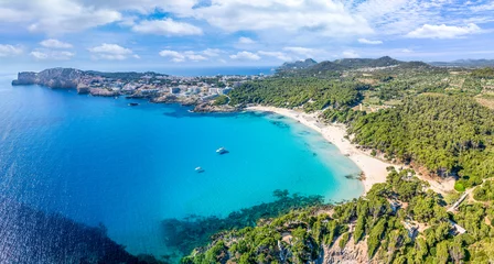 Poster Aerial view of Cala Agulla and beautiful coast at Cala Ratjada, Mallorca: pristine beach, crystal waters, surrounded by nature, perfect Mediterranean escape. © Serenity-H