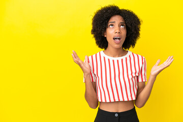 Young African American woman isolated on yellow background stressed overwhelmed