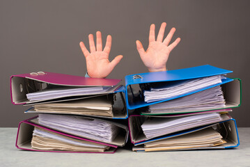 Exhausted tired worker, pile of file folders, hands up, burnout, stress and overworked, pressure at...