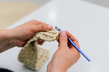 Process of knitting isolated on white, female hands