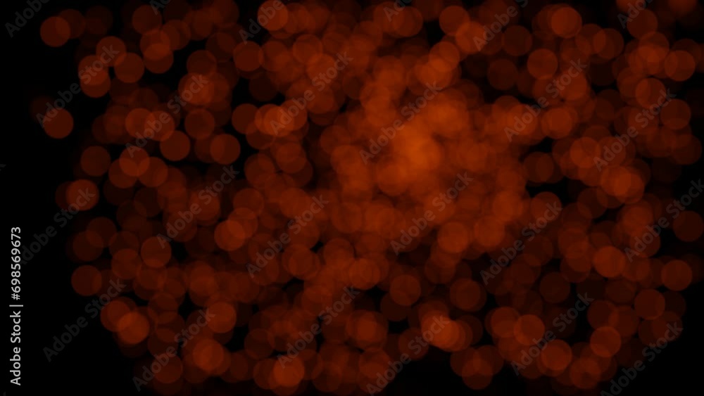 Poster blinking and glowing red-orange particles move chaotically on a black background. looped animation. 