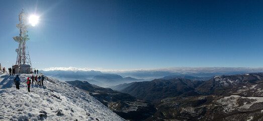 Gorgeous winter mountain panorama showcasing snow-capped peaks, serene valleys, and icy streams...