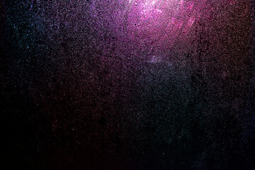 Black dark red blue pink purple orange golden shiny glitter abstract background with space....