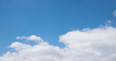 horizontal sky background, blue above and clouds in the lower half