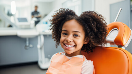 A smiling african american kid sitting in a dental chair at the dentist, teeth cleaning and examination concept, beautiful white teeth smile, young girl checkup - obrazy, fototapety, plakaty