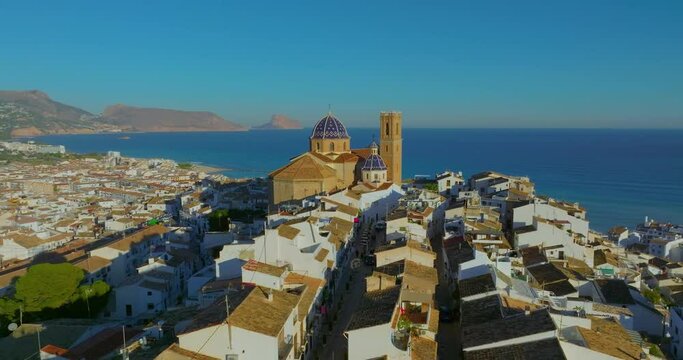 Spanish city of Altea in the city center on the mountain church with a blue roof. Aerial view of the city of Altea and the picturesque Mediterranean coast. Spain