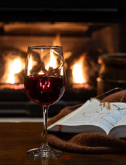 Glass of wine with fireplace in background