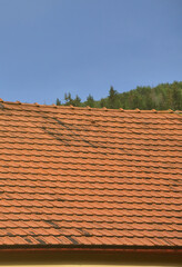 The roof of this square ceramic tile is red. The old type of roof covering in rich houses of the...