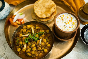 Halwa chana puri, and boondi raita, Halwa Puri is a comforting, hearty meal that's popular in India and Pakistan for weekend breakfast or during festival season.