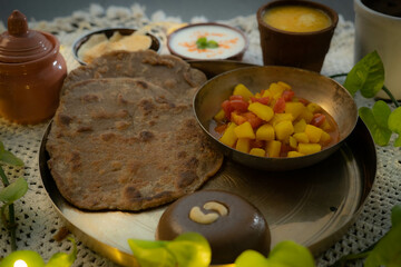 Vrat ki Healthy Thali, Navratri Thali - A Falahaari Delight of Rajgira Ke Puri, Aloo Ki Sabji, Boondi Raita and Singhare Ka Halwa and Aamras.