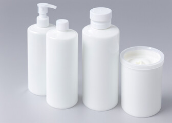 A group of white bottles, cosmetics, soap, cream. 