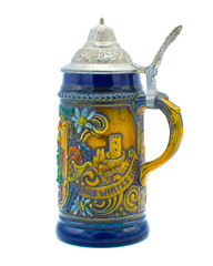 Old Vintage German beer stein Mug with pewter hinged top with words ein gutes bier des wirtes zier good beer from the landlord and men drinking at a table. Isolated on white background side view 2