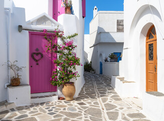 Beautiful Marpissa, with a famous pink door on insta. Paros, Greece
