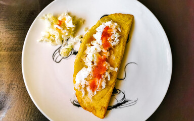Mexican empanada on white plate from Playa del Carmen Mexico.