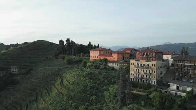 Aerial orbit shot of the little village of Montevecchia, Italy. Stunning architecture and beautiful forests around. 4K drone shot.