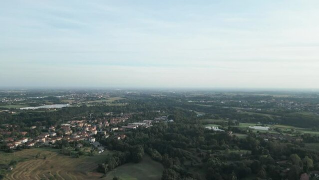 Aerial view of italian countryside from the little village of Montevecchia, Italy. Stunning architecture and beautiful forests around. 4K drone shot.