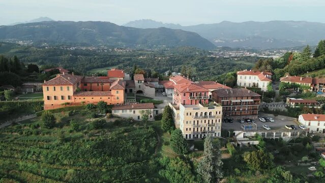 Aerial shot of the little village of Montevecchia, Italy. Stunning architecture and beautiful forests around. 4K drone shot.