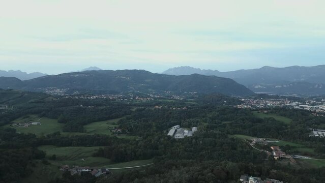 Aerial view of italian countryside at sunset from the little village of Montevecchia, Italy. Stunning architecture and beautiful forests around. 4K drone shot.