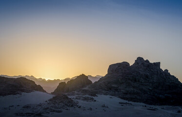 peaks of mountains in the desert of egypt against sunset
