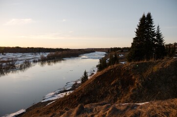 river on a spring evening during an ice drift view from the hill