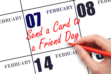 February 7. Hand writing text Send a Card to a Friend Day on calendar date. Save the date.