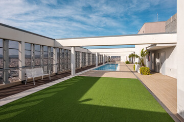 Luxury villa with artificial lawn and open-air pool on roof