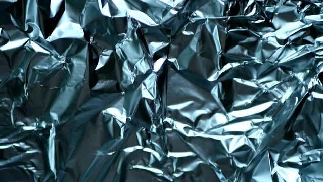Metal texture stop motion video. Crumpled aluminium background. Abstract backdrop 