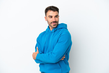 Obraz premium Young caucasian man isolated on white background looking to the side and smiling