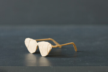 A brand new glasses wrapped in rustic beige craft paper. Black Friday shopping concept.