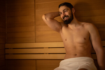 The handsome man is enjoying in the SPA center