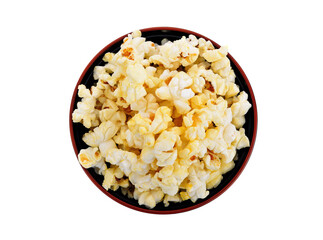Popcorn in black bowl isolated on white background. Top view