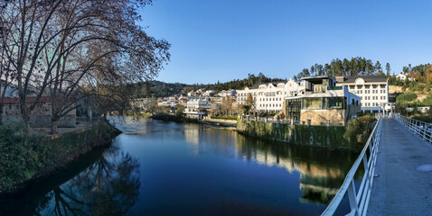 Fototapeta na wymiar Panoramic view of the thermal area of S. Pedro do Sul, Vouga River and buildings on the banks of the river supporting thermal spas, hotels and others, Viseu, Portugal