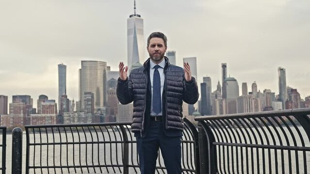 Man in suit speaking in NYC. Speaker in Ney York. Politics Man. Motivational speaker on American street. Talking about, Diversity, Success, Leadership. Man Presenter Leads Tech Business Conference.