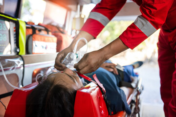 male patient had an accident. An ambulance and rescue team came to provide first aid and put on a...