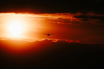 Obraz na płótnie Canvas sunset in the sky with plane