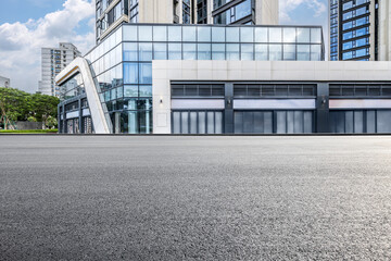 Empty asphalt and city buildings landscape in summer