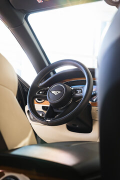 Bentley Bentayga Steering wheel view from rear seat, cinematic - High Resolution Image