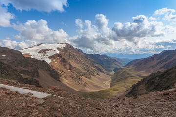 Awesome alpine highlands countryside. Alpine valley with glacier , stream and moraines. Planol...