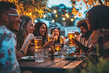 Schilderijen op glas Happy smiling friends drinking beer glasses sitting at brewery pub restaurant table © amankris99
