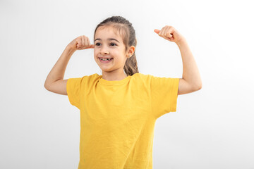 Little girl hand flexing demonstrating biceps isolated on white background.