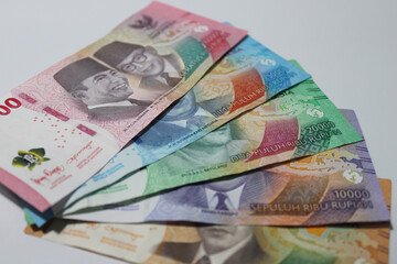 Colorful Indonesian rupiah bank notes against a white background