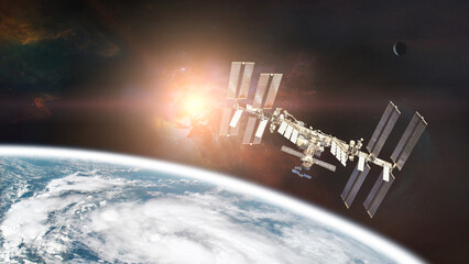 International Space Station on low-orbit of Earth with rising Sun. Elements of this image furnished by NASA.