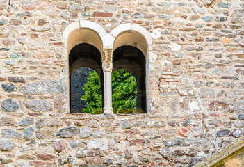 T yrol castle in South Tyrol. Facade with  Bifora tye window with central column. Medieval...
